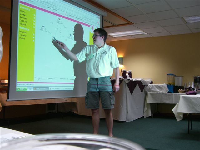 Justin Krohn, WTI student research assistant, shows an OLSR visualization of a live mesh network.